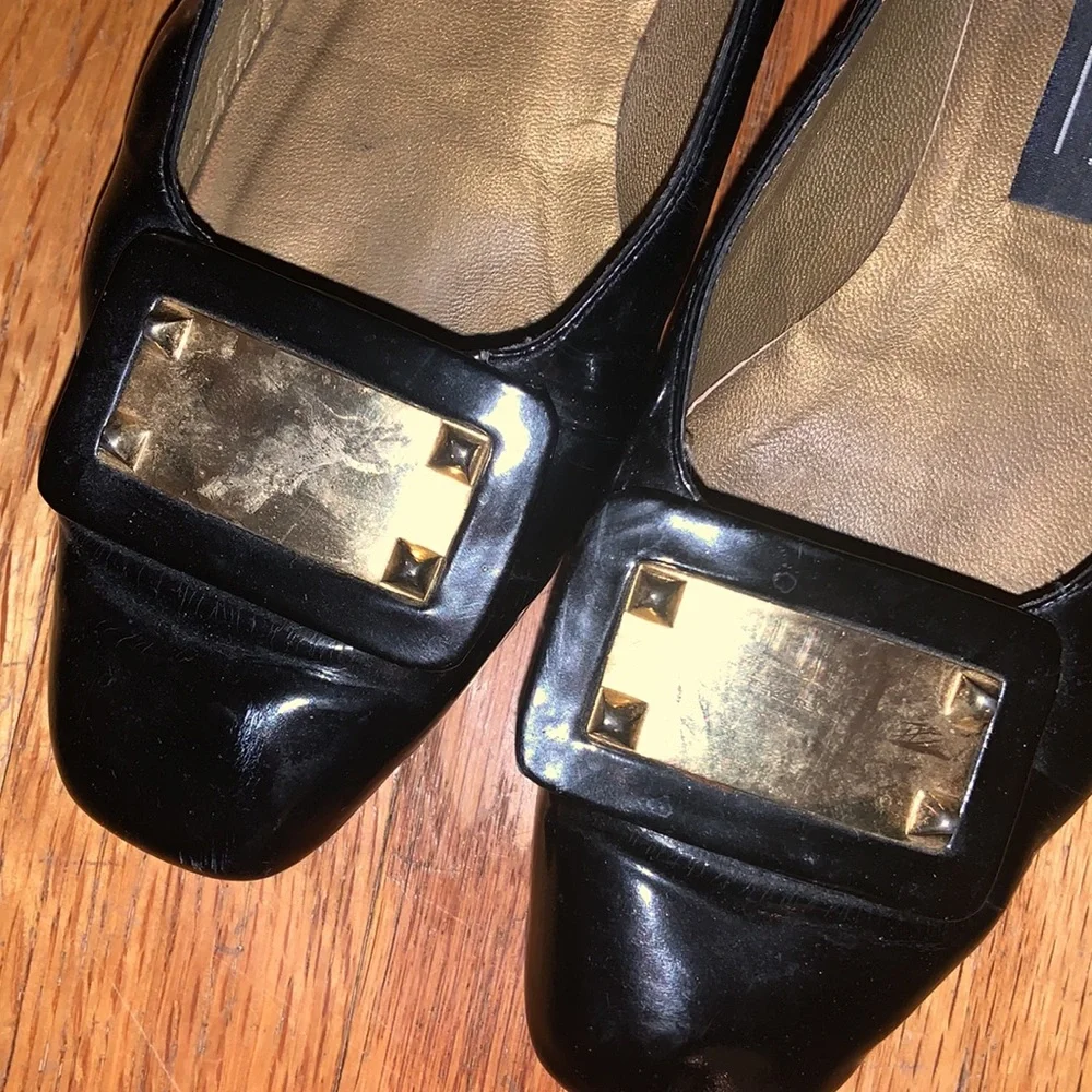 Stuart Weitzman black patent leather loafers with gold plaques and low heel 6